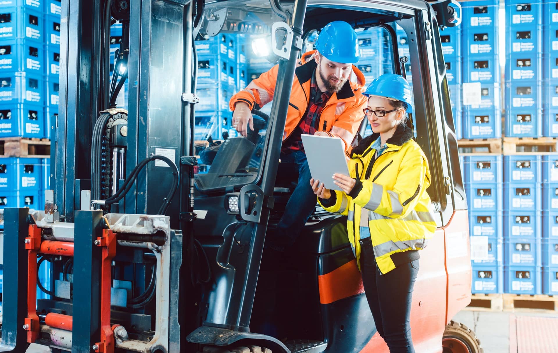 Forklift driver taking instructions for food logistics