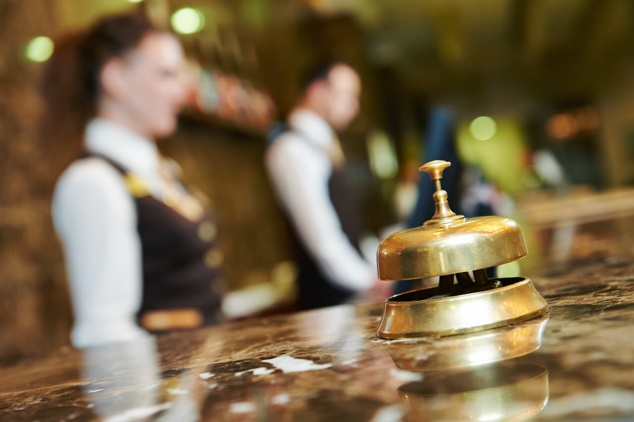 Bell at hotel front desk reception area