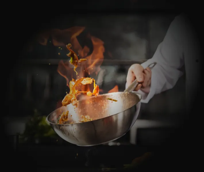 Food being flamed in wok